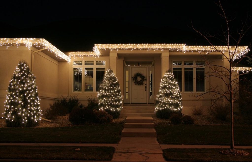 Luxury home with holiday lights by home sweet home in Babcock Ranch, Florida
